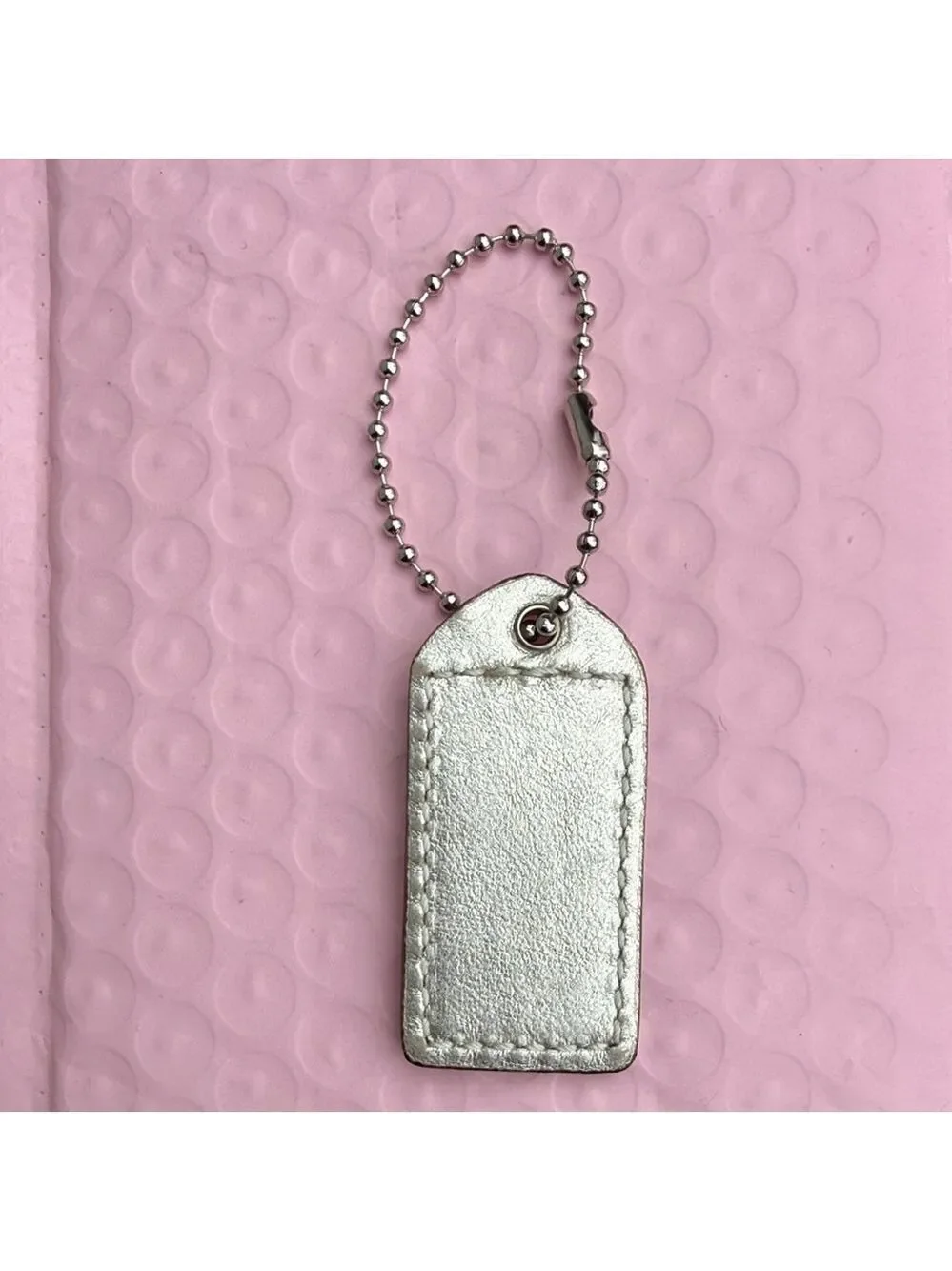 Coach Shimmering Silver Tag Keychain Coach Hangtag Coach bag accessories